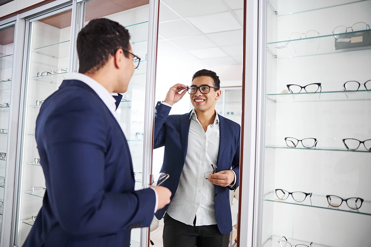 a man trying on eyewear in an optical